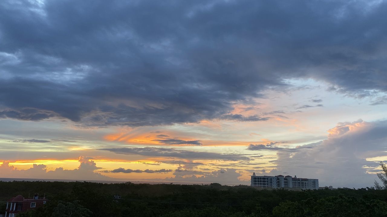 BUILDINGS AGAINST SKY AT SUNSET