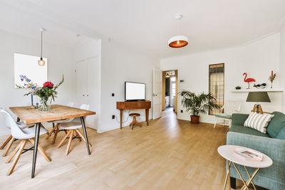 Empty chairs and table against wall at home