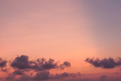 Low angle view of silhouette trees against romantic sky