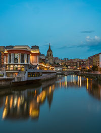 Reflection of illuminated buildings in river