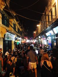 Crowd at market in city at night