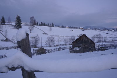 House on snow covered field