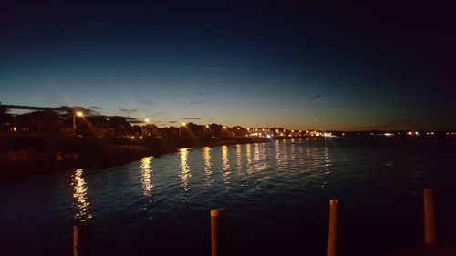 Scenic view of sea against sky at night