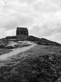 Old ruins of building against cloudy sky