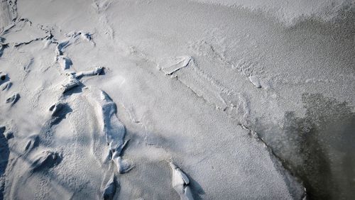 High angle view of footprints on snow