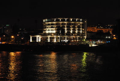 Buildings in city at night