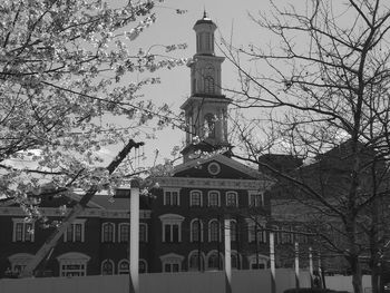 Low angle view of building and trees against sky