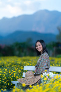 Portrait of a smiling woman on field