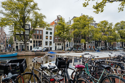 Bicycles in city against sky