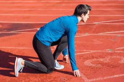 Rear view of senior man running