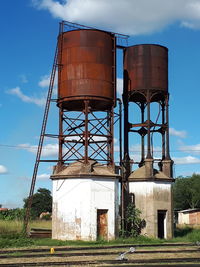 Low angle view of water tower against sky