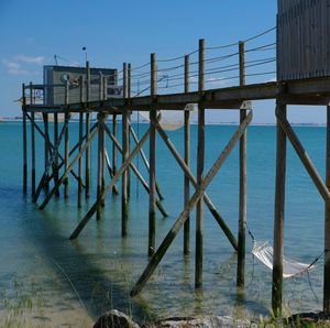 Pier on sea against sky