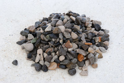 High angle view of stones on pebbles