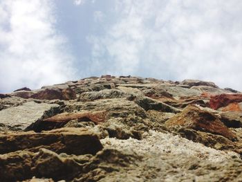 Low angle view of rock formations against sky