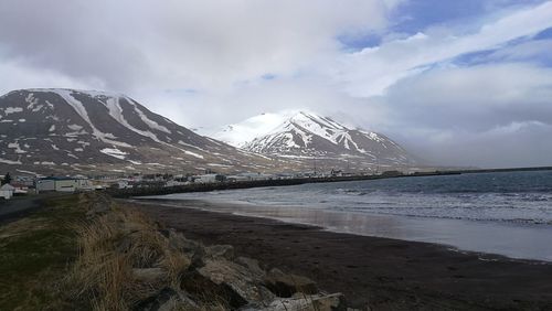 Scenic view of snowcapped mountains against sky