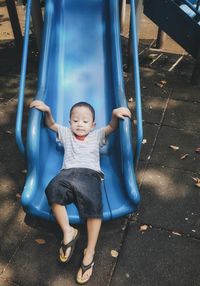 High angle view of cute boy in playground