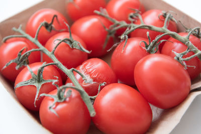 High angle view of cherry tomatoes in container