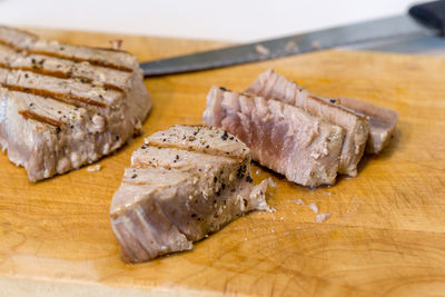 High angle view of meat on cutting board