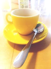 Close-up of coffee cup on table