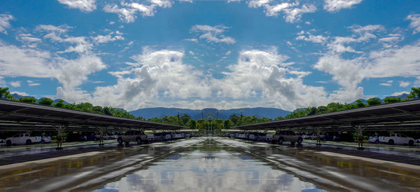 Panoramic view of bridge over canal against sky
