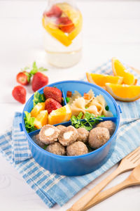 Close-up of fruits in bowl on table