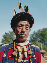 Portrait of man wearing hat against sky