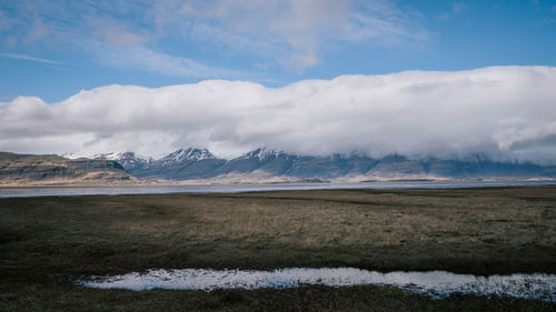 Scenic view of snowcapped mountains against sky