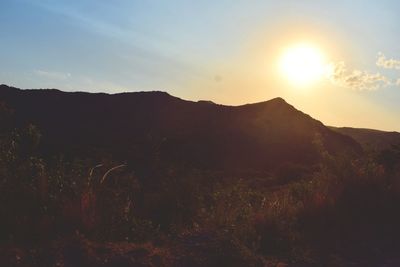 Scenic view of mountains against sky during sunset