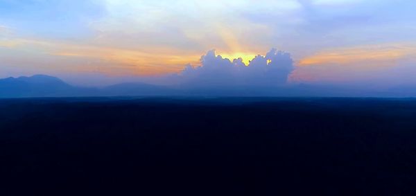 Scenic view of silhouette landscape against sky during sunset