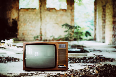 Old television set in abandoned house