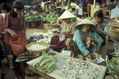 People at market stall