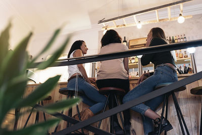 People sitting on railing