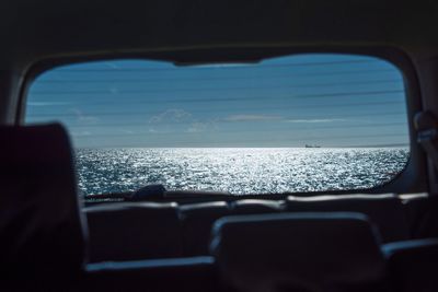 Close-up of airplane seen through car window