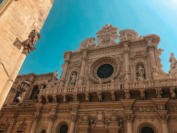Low angle view of historical building against blue sky
