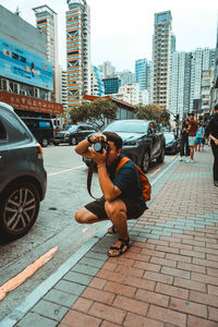 Full length of men on street in city