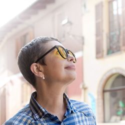 Portrait of a smiling young woman looking away