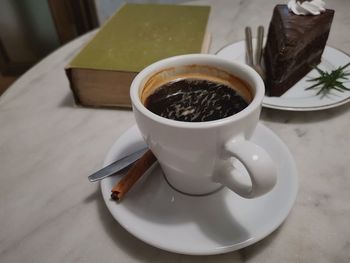 Close-up of coffee cup on table