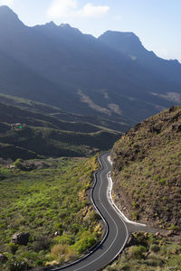 High angle view of road amidst mountains against sky