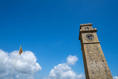 Low angle view of clock tower against sky