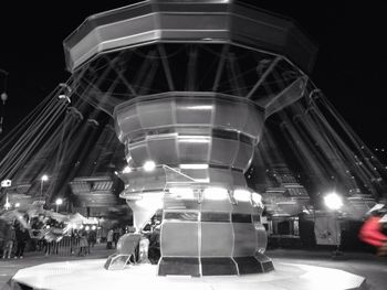 Low angle view of illuminated ferris wheel at night