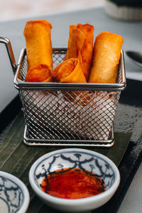 Hot spring rolls with spicy sauce. traditional thai food