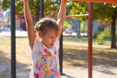 Portrait of girl playing in playground