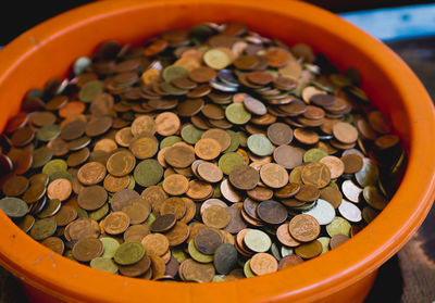 High angle view of coins in container