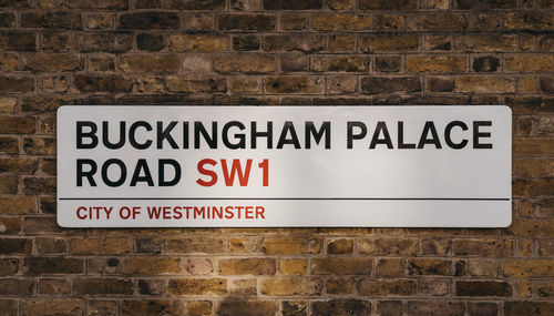 Street name sign on buckingham palace road, a famous street in london, uk.
