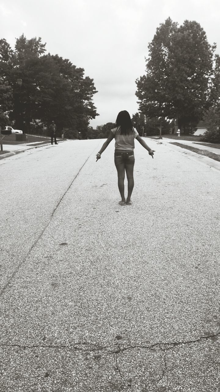 full length, rear view, the way forward, tree, walking, lifestyles, transportation, casual clothing, road, leisure activity, street, vanishing point, diminishing perspective, men, day, sky, outdoors, childhood