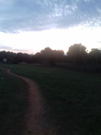 Scenic view of field against sky during sunset