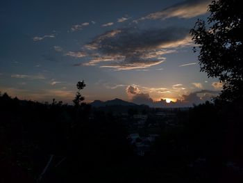 Silhouette of landscape against sky at sunset