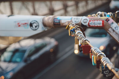 Close-up of love locks hanging on railing at brooklyn bridge