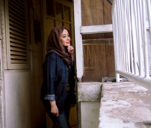 Woman looking awat while standing at entrance