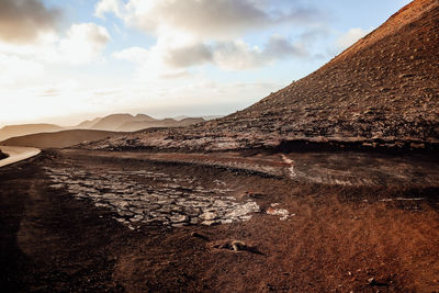 Scenic view of arid landscape against sky